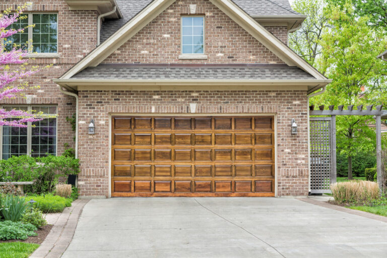 Off-track garage door realigned and repaired in Prosper, TX